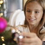 little-girl-decorating-christmas-tree